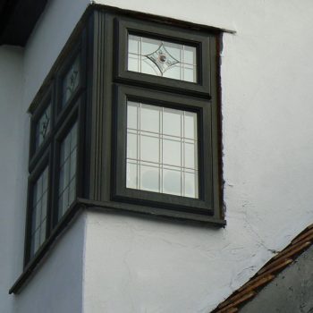 Black corner windows with lead detail and decorative windows