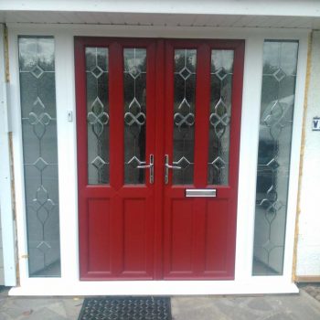 Red double entrance doors with side panels